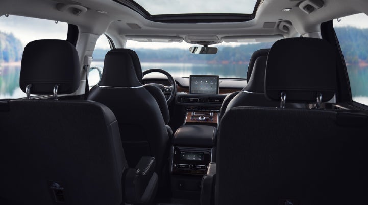 The interior of a 2024 Lincoln Aviator® SUV from behind the second row | Buss Lincoln in McHenry IL