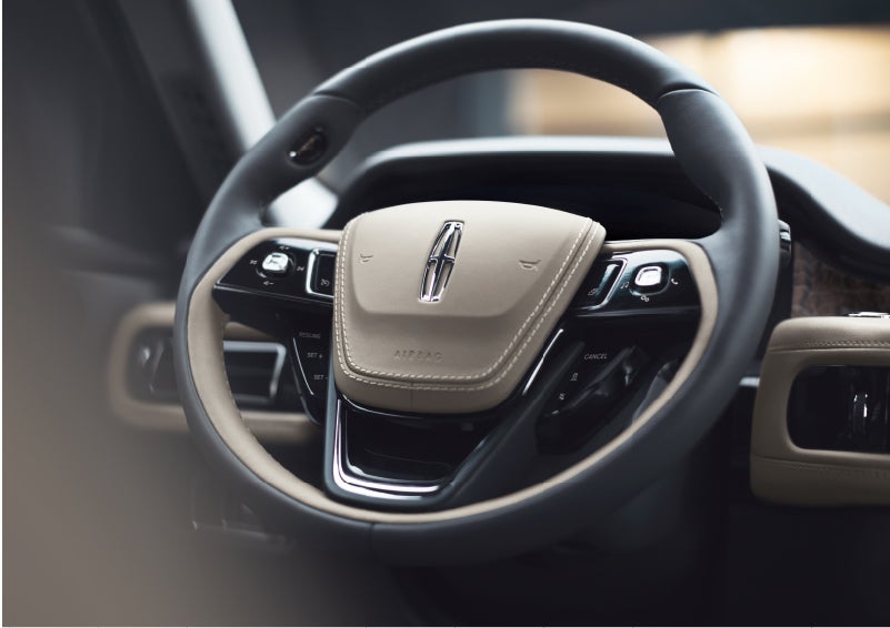 The intuitively placed controls of the steering wheel on a 2023 Lincoln Aviator® SUV | Buss Lincoln in McHenry IL