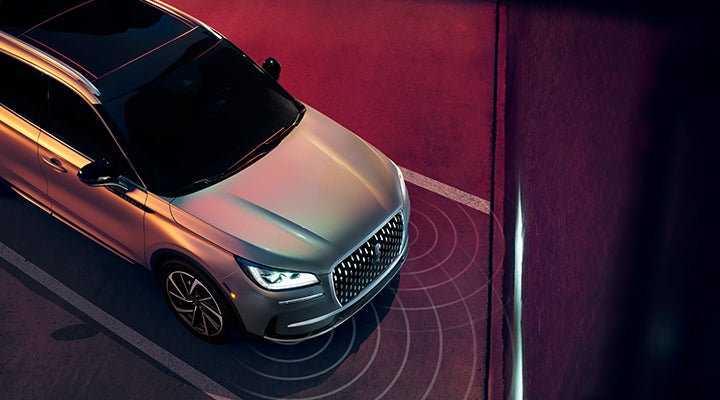 Illustrated radar signals are shown emitting from the front of a 2024 Lincoln Corsair® SUV. | Buss Lincoln in McHenry IL