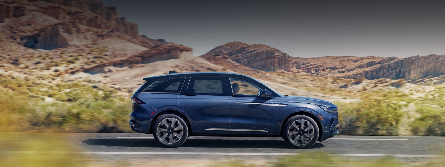 A 2024 Lincoln Nautilus® SUV is being driven in a desert setting. | Buss Lincoln in McHenry IL