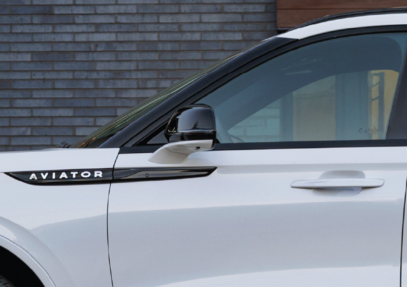 The driver’s door of a white 2025 Lincoln Aviator® SUV is showcased. | Buss Lincoln in McHenry IL