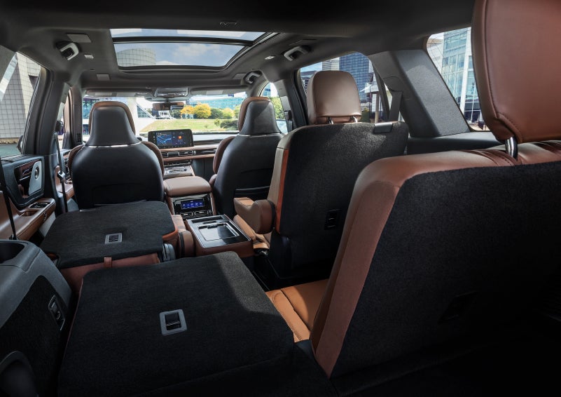 The interior of the 2025 Lincoln Aviator® SUV is shown with two seats folded down for added space. | Buss Lincoln in McHenry IL
