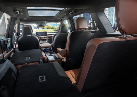 The interior of the 2025 Lincoln Aviator® SUV is shown with two seats folded down for added space. | Buss Lincoln in McHenry IL