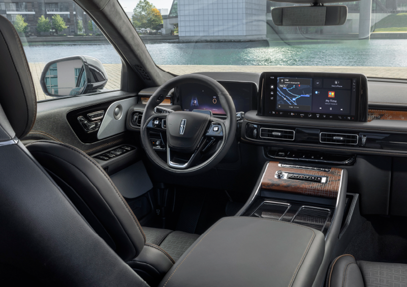The interior of the 2025 Lincoln Aviator® SUV is shown parked with a view of a harbor through the windshield. | Buss Lincoln in McHenry IL