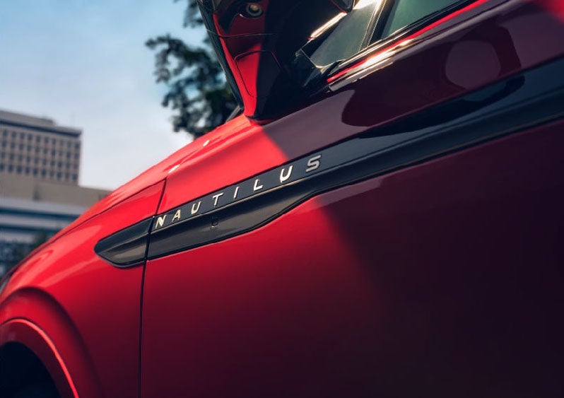 A side badge on the passenger door reads Nautilus. | Buss Lincoln in McHenry IL