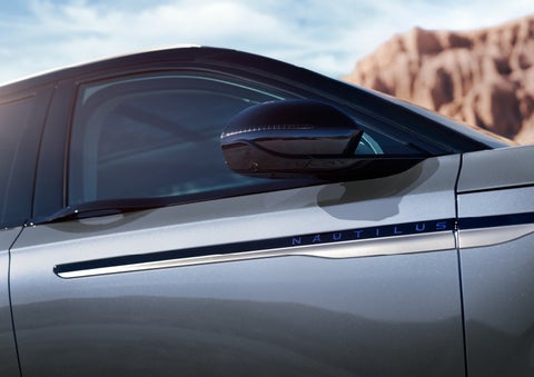 Blue lettering on the side of the vehicle that reads nautilus indicates the available hybrid powertrain. | Buss Lincoln in McHenry IL