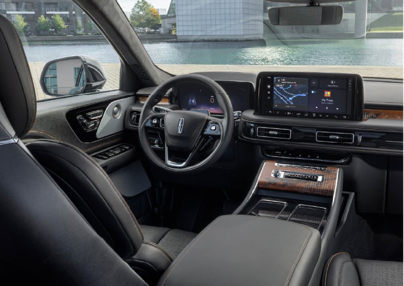 The interior of the 2026 Lincoln Aviator® SUV is shown parked with a view of a harbor through the windshield. | Buss Lincoln in McHenry IL