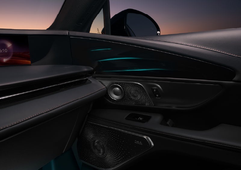 Selectable ambient lighting glows in the passenger door panel. | Buss Lincoln in McHenry IL