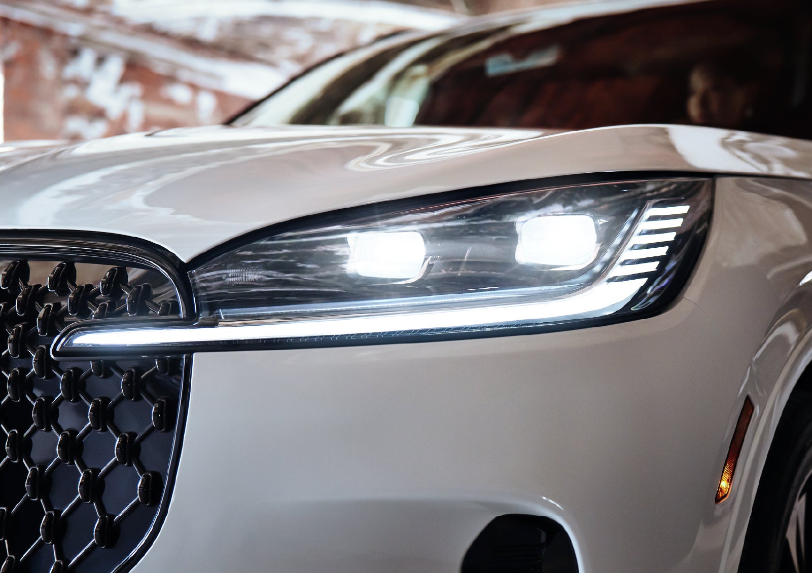 A close-up of a headlamp on the 2027 Lincoln Aviator® SUV is shown. | Buss Lincoln in McHenry IL