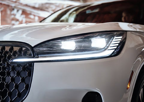 A close-up of a headlamp on the 2027 Lincoln Aviator® SUV is shown. | Buss Lincoln in McHenry IL